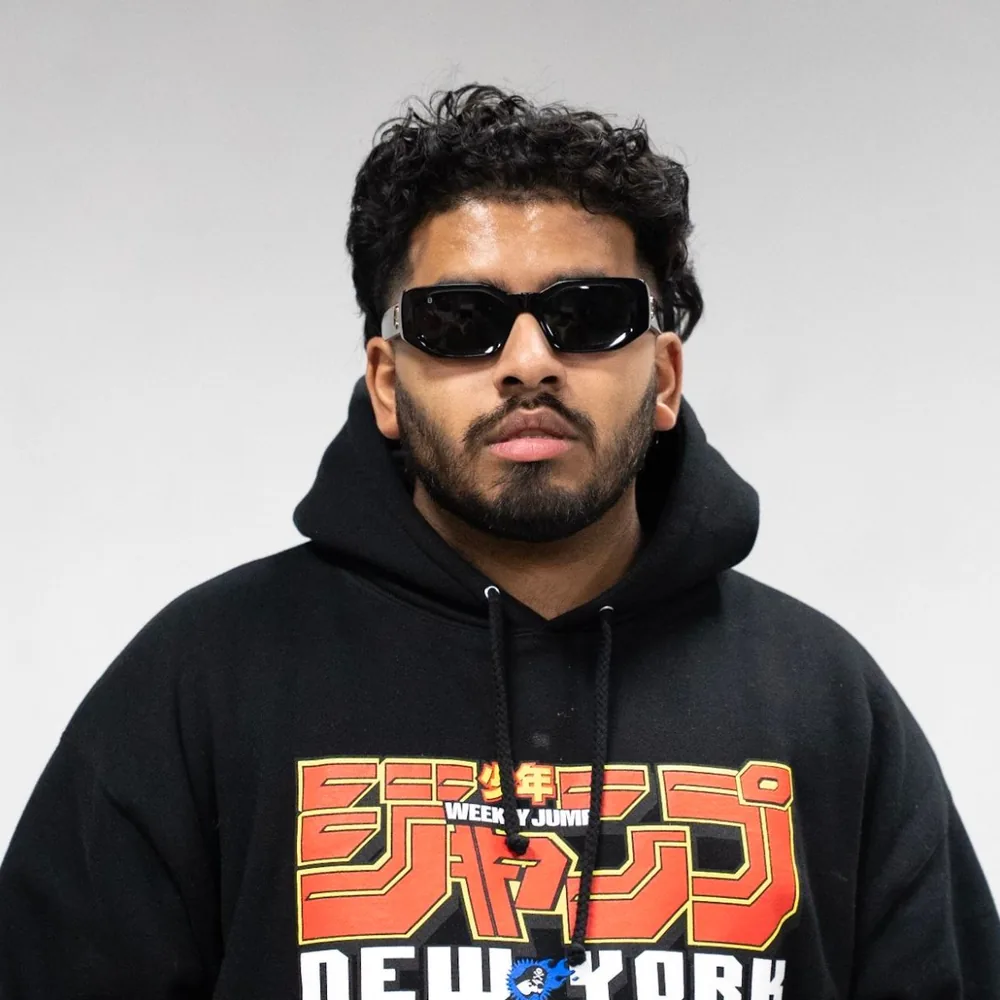 drtyndn portrait in black sunglasses and a Weekly Jump New York hoodie